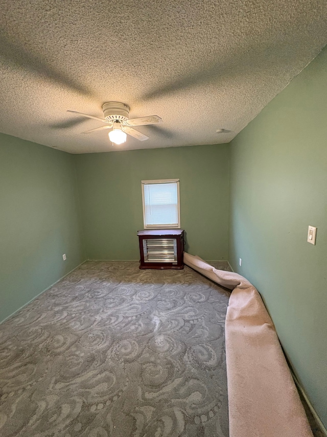 unfurnished bedroom with ceiling fan and carpet flooring