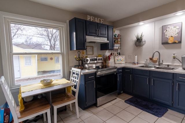 kitchen with blue cabinetry, stainless steel electric stove, light tile patterned flooring, and sink