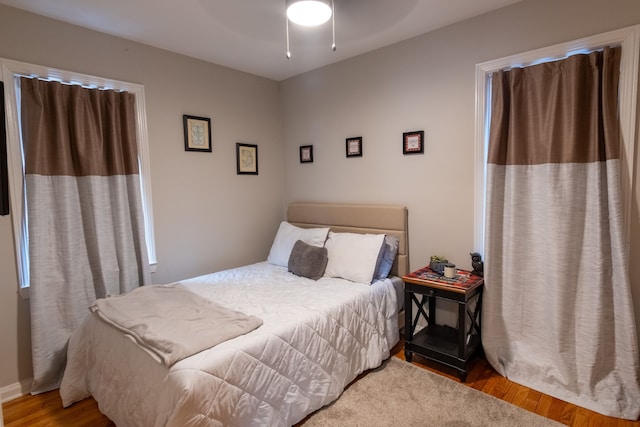 bedroom featuring wood-type flooring and ceiling fan