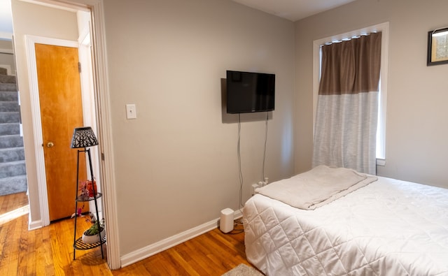 bedroom featuring hardwood / wood-style flooring