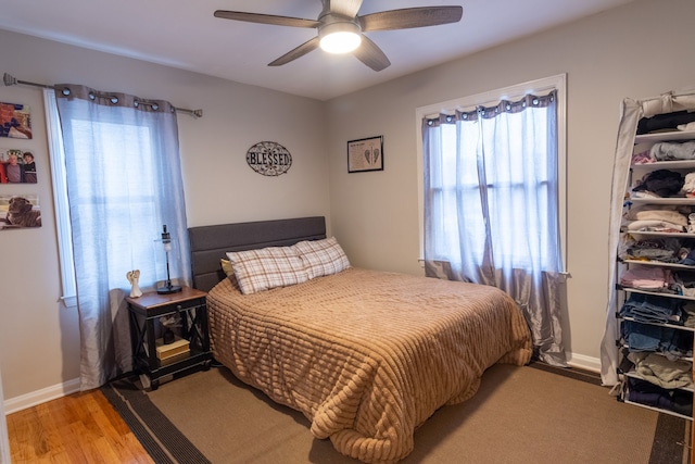 bedroom featuring light hardwood / wood-style floors and ceiling fan