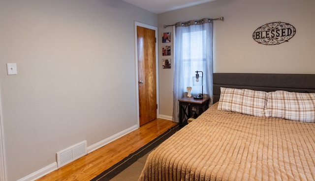 bedroom featuring hardwood / wood-style flooring