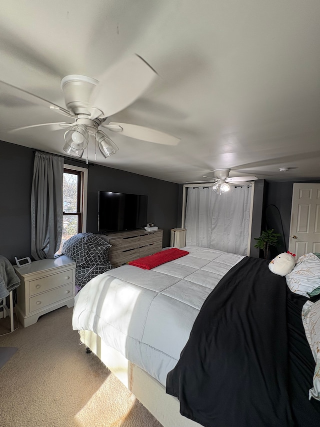 carpeted bedroom with ceiling fan