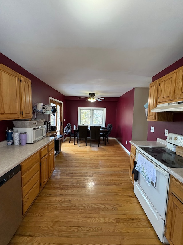 kitchen with ceiling fan, light wood-type flooring, and white appliances