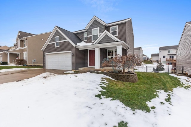 view of front of property featuring a garage and a lawn