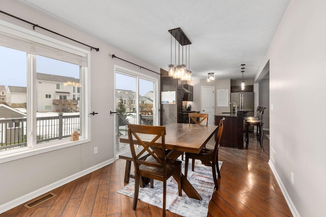 dining room with dark hardwood / wood-style floors