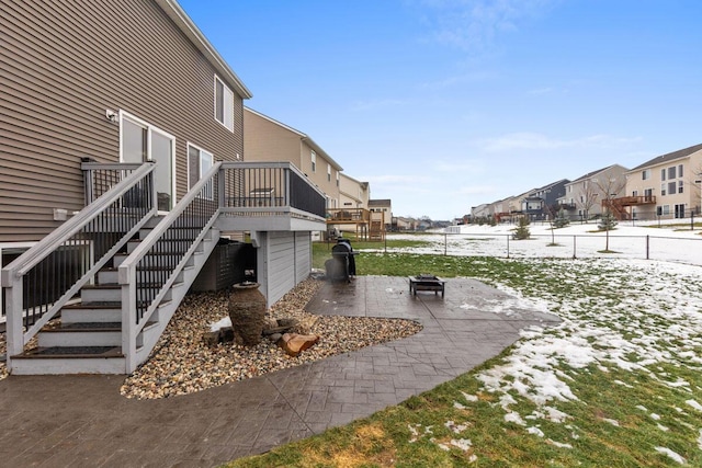 view of yard with a wooden deck, a patio area, and a fire pit