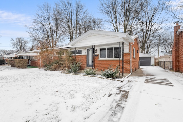 bungalow-style house with an outbuilding and a garage