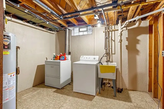 laundry room with washer and clothes dryer, sink, and gas water heater