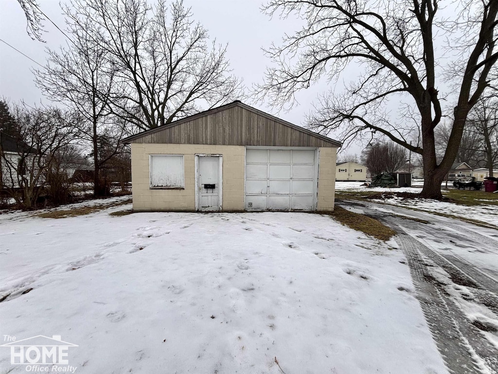 view of snow covered garage