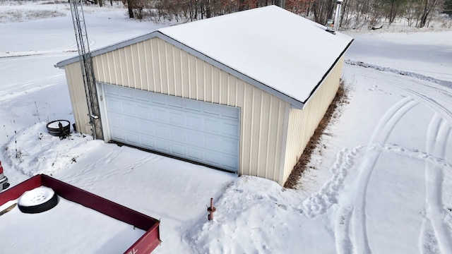 view of snow covered garage