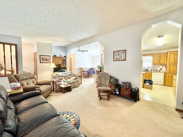 living room with light carpet and a textured ceiling