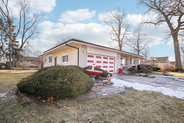 view of home's exterior with a yard and a garage