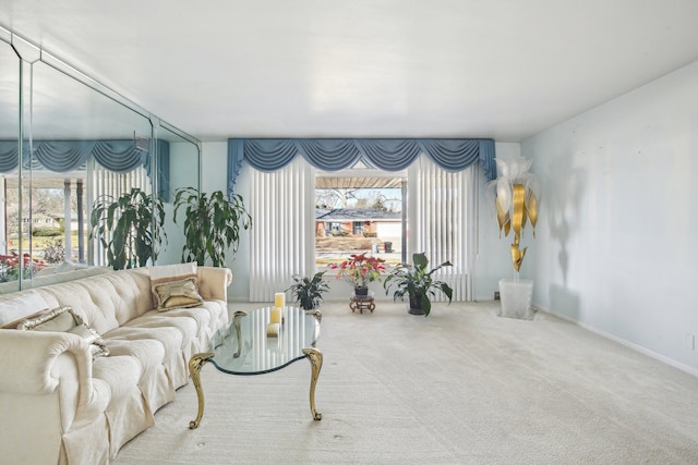 carpeted living room with a healthy amount of sunlight