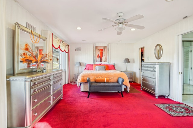 bedroom featuring ceiling fan and carpet