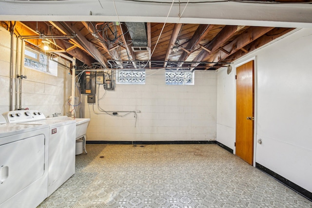 laundry area featuring separate washer and dryer and a wealth of natural light