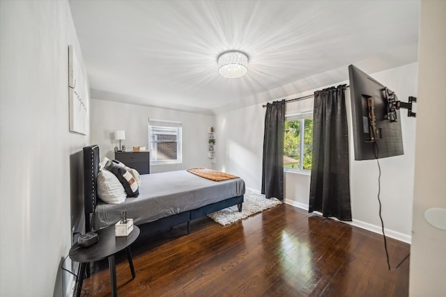 bedroom with hardwood / wood-style floors