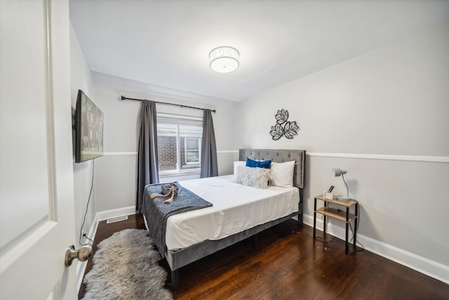 bedroom featuring dark hardwood / wood-style floors