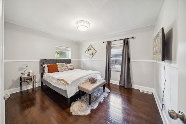 bedroom featuring dark hardwood / wood-style floors