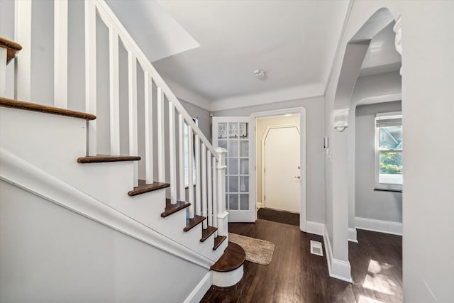 entrance foyer featuring dark wood-type flooring