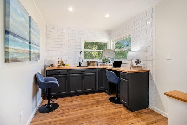 office featuring sink and light hardwood / wood-style flooring