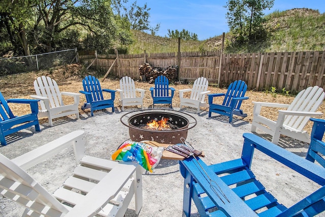 view of patio with a fire pit