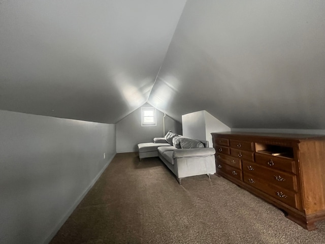 carpeted bedroom with lofted ceiling