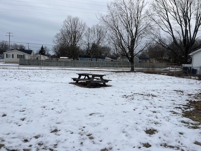 view of yard layered in snow