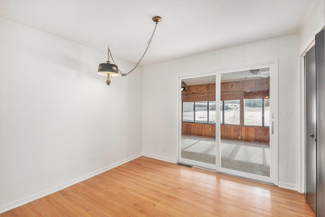 unfurnished dining area featuring hardwood / wood-style flooring