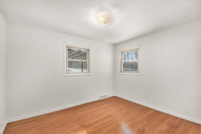 spare room featuring hardwood / wood-style flooring