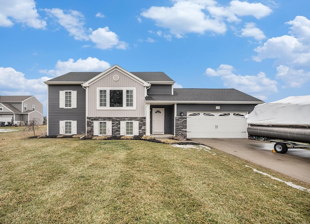 view of front of home featuring a garage and a front yard