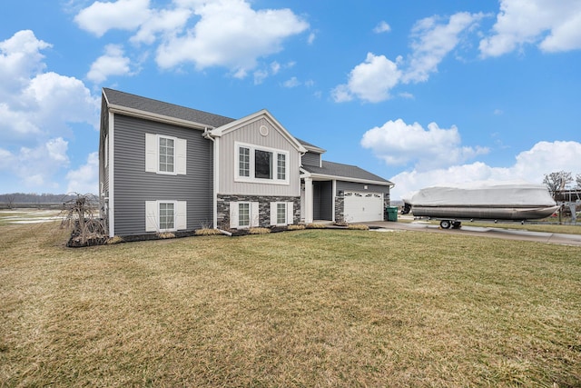 split foyer home with a garage and a front lawn