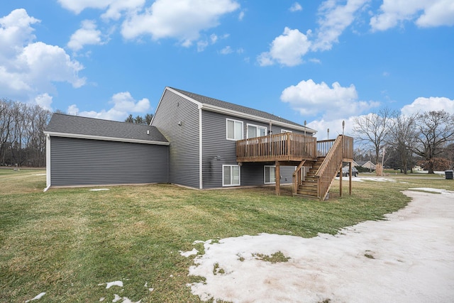 back of house featuring a wooden deck and a lawn