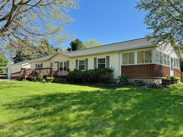 281 Mirror Dr, Jerome, MI 49249 - rear view of house with a deck, a yard, a sunroom, and a garage