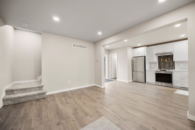 unfurnished living room featuring light wood-type flooring