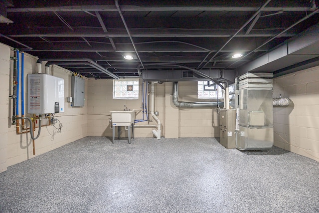 basement featuring tankless water heater, electric panel, sink, and heating unit