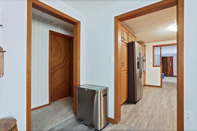 hallway featuring light hardwood / wood-style flooring