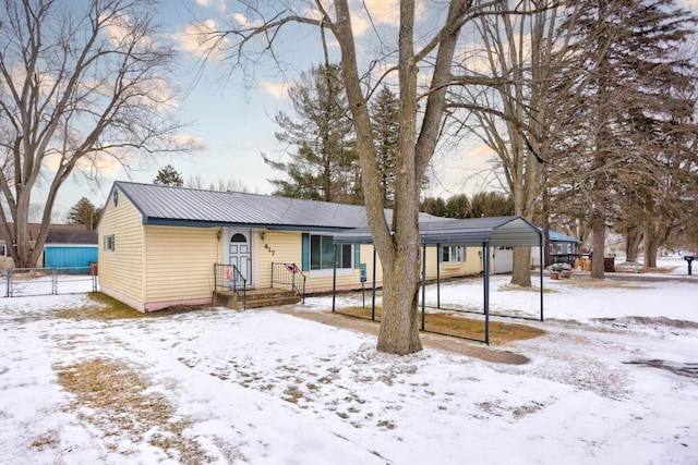 ranch-style house with a carport