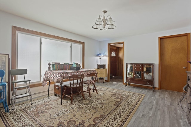 dining area featuring a chandelier and hardwood / wood-style floors