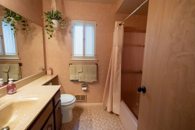 full bathroom with vanity, shower / bathtub combination with curtain, and toilet