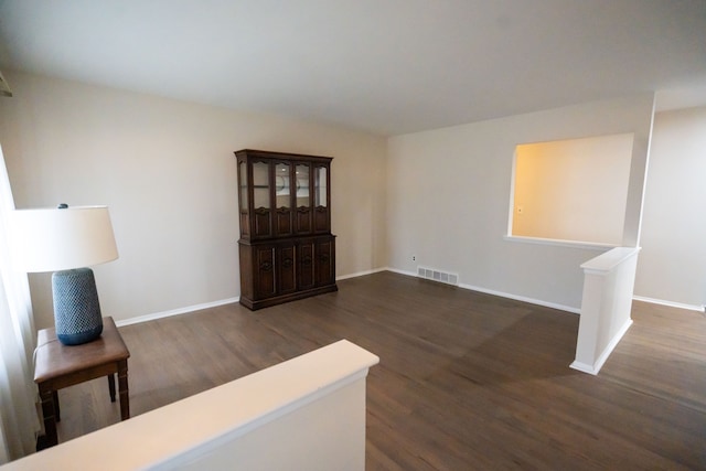 living room featuring dark wood-type flooring