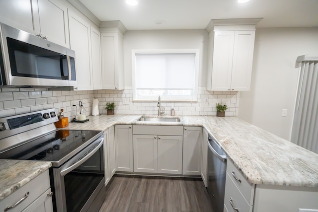 kitchen featuring white cabinetry, appliances with stainless steel finishes, and sink