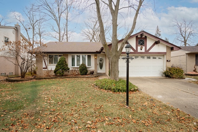 view of front of property featuring a garage and a front yard