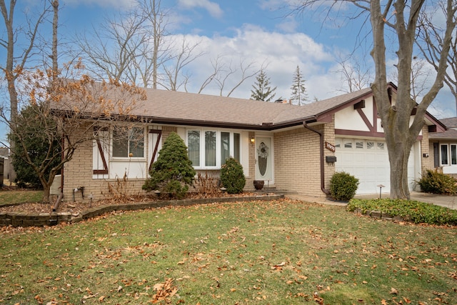 single story home with a garage and a front lawn