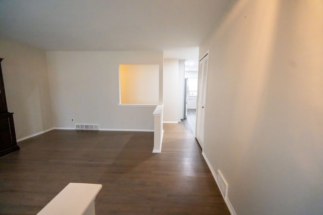 interior space with dark hardwood / wood-style flooring