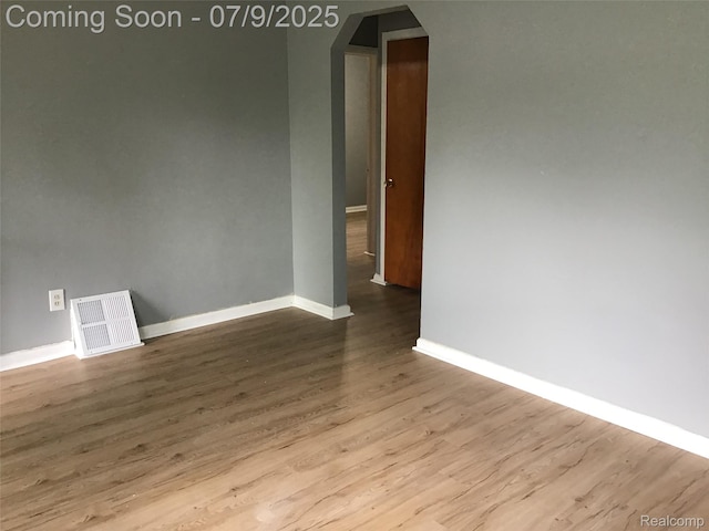 19611 W Chicago St, Detroit, MI 48228 - spare room featuring arched walkways and wood finished floors