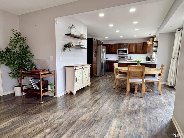 dining area with dark wood-type flooring