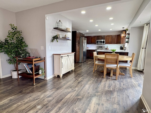 dining room featuring dark hardwood / wood-style flooring