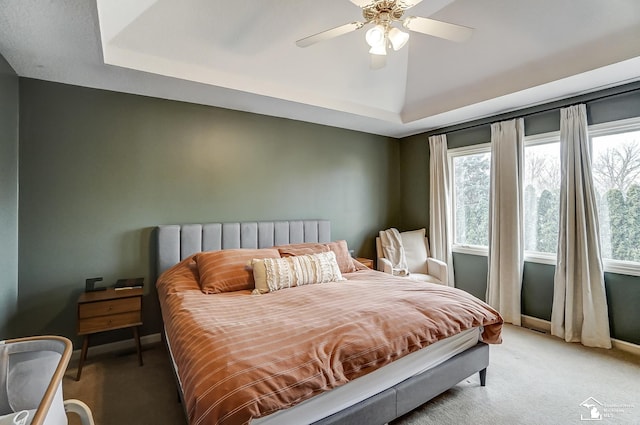 bedroom featuring multiple windows, vaulted ceiling, and carpet floors