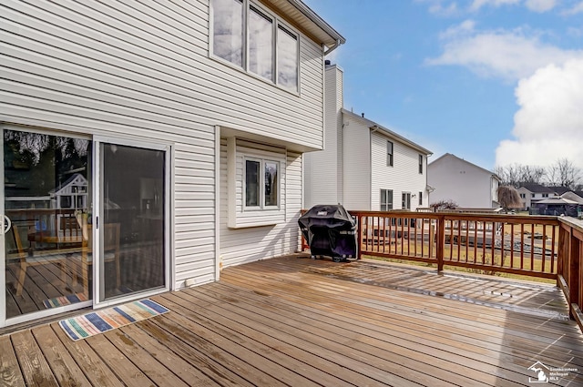 wooden terrace with area for grilling